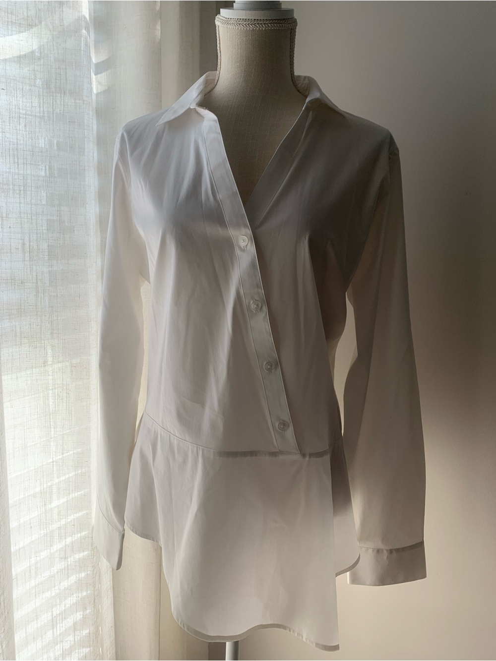 Classic White Button-Front Peplum Blouse with Asymmetrical Design